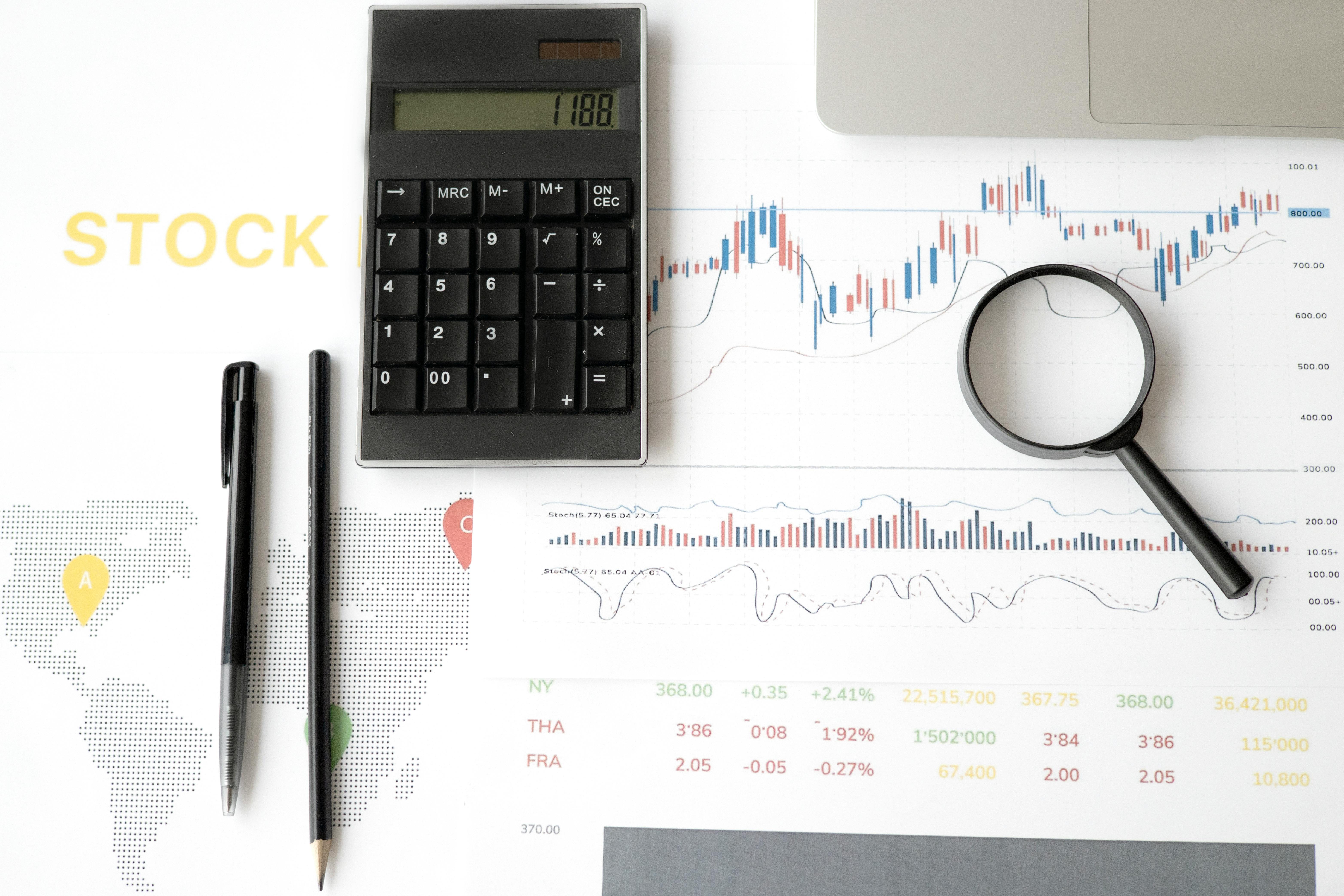 Hand business woman doing finances and calculate on desk about cost at office.